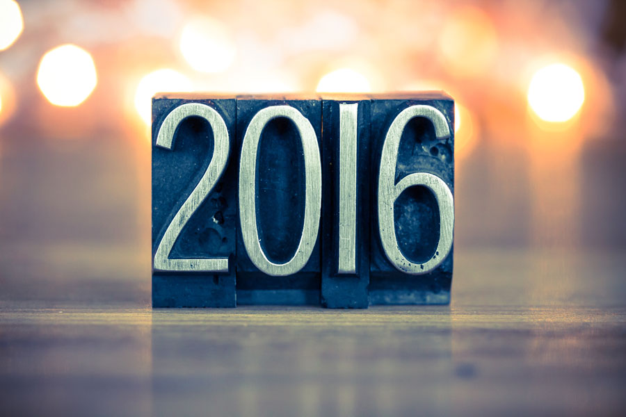 The word 2016 written in vintage metal letterpress type on a soft backlit background.